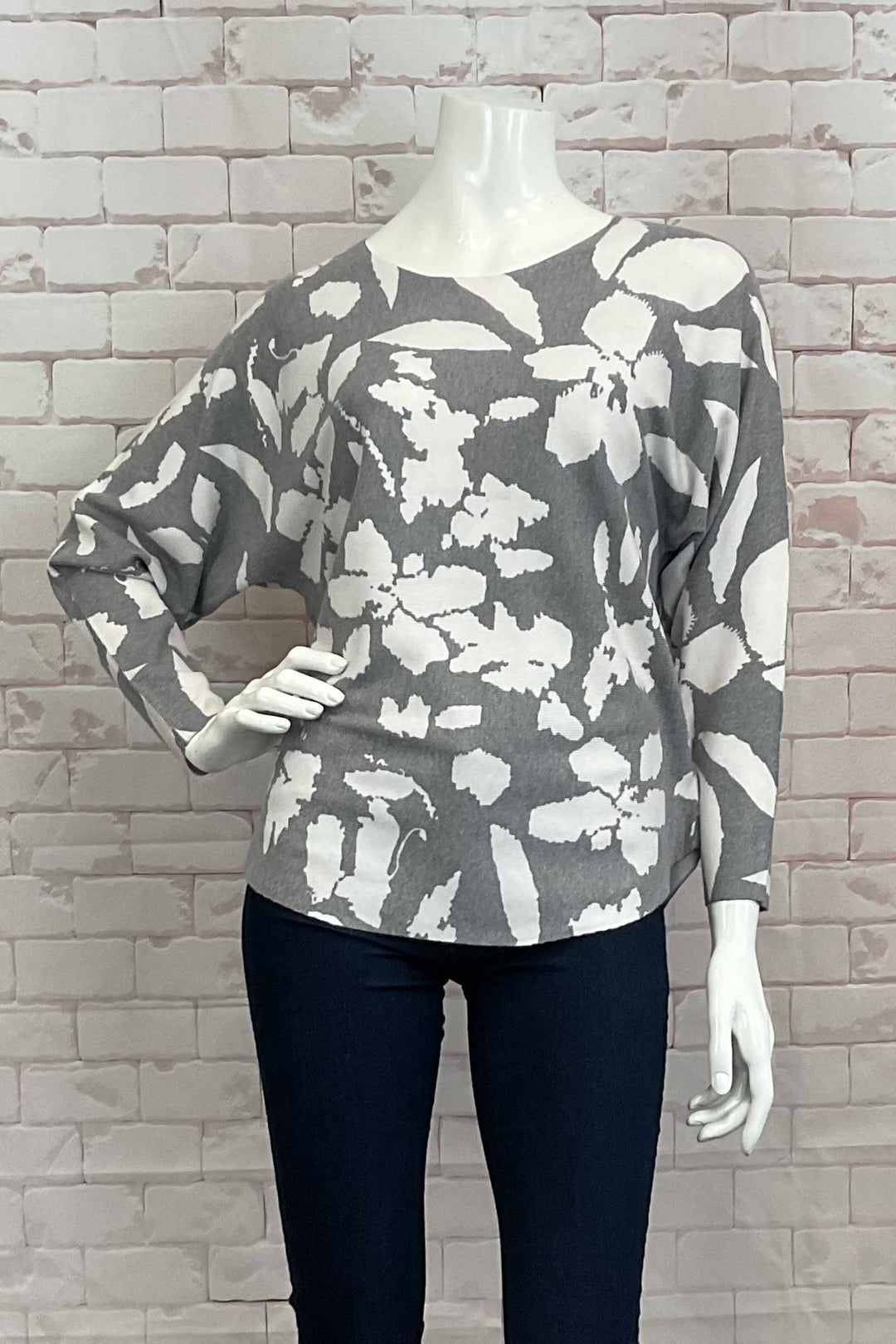 Variations Fall 2024  The round neck and slightly loose fit provide both comfort and style. Perfect for pairing with joggers, jeans or even capris, and featuring a lovely floral abstract print with a neat rounded hemline. 