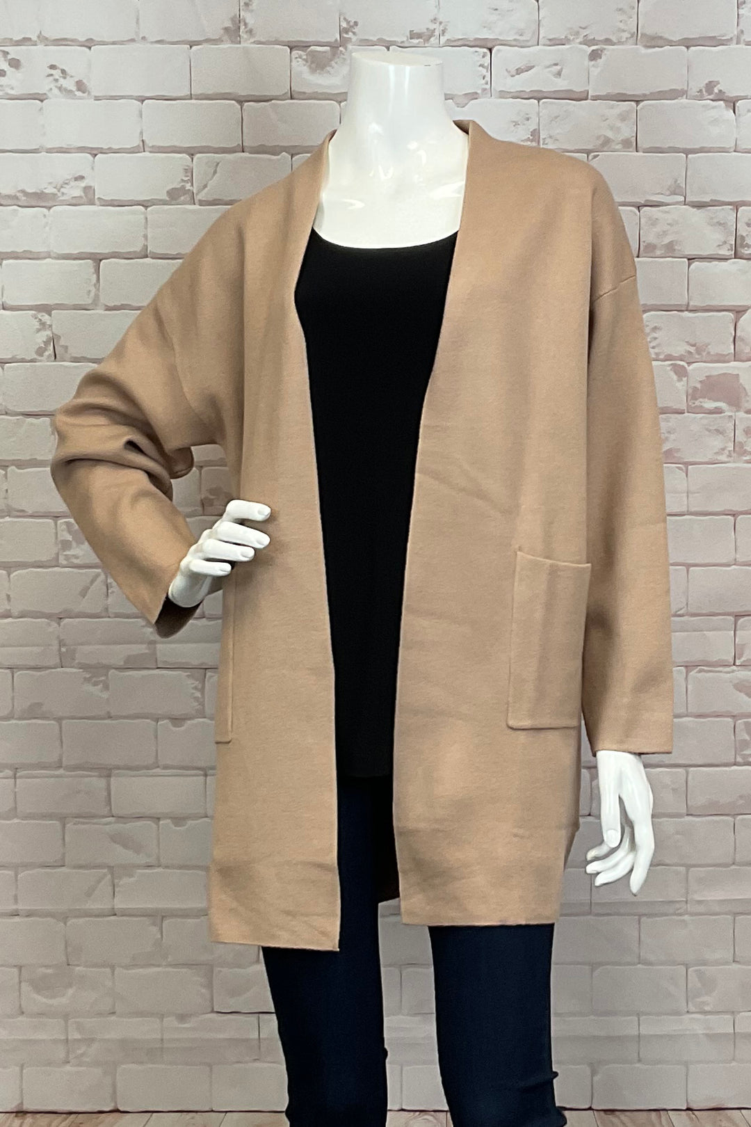 BOLIDE Fall 2024 Its lightweight design and drop shoulders provide a nice fall and comfortable fit. Pair with trousers and a classic white blouse for a polished and office-ready ensemble. With an open front and convenient front pockets, this cardigan combines fashion and functionality.