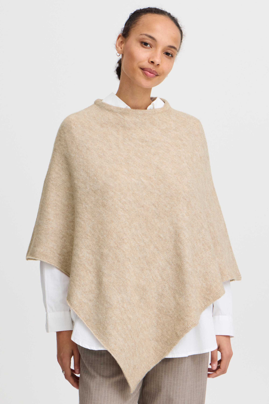 B. Young Fall 2024 Knit to perfection, its sharp point tip in the front and back adds a touch of sophistication. Its light and flowy material drapes elegantly over any outfit, making it a perfect addition to your wardrobe.