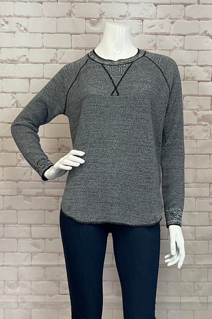 Cotton Country Fall 2024 The Skyler Sweater is a stylish and comfortable light sweater, made from 100% cotton. It features a unique raglan shoulder detail as well as a shirttail hem on both the front and back.