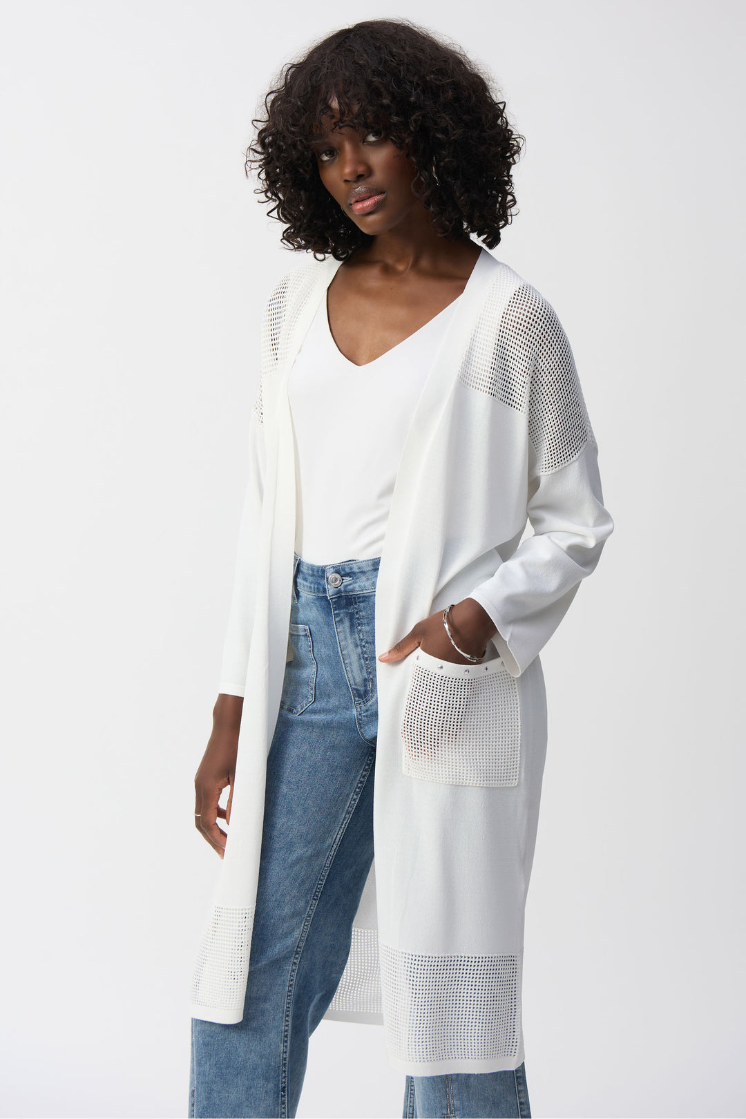 Joseph Ribkoff Spring 2025 Perfect for layering over any ensemble, the neat mesh contrast detailing elevates this long cardigan to a statement piece!