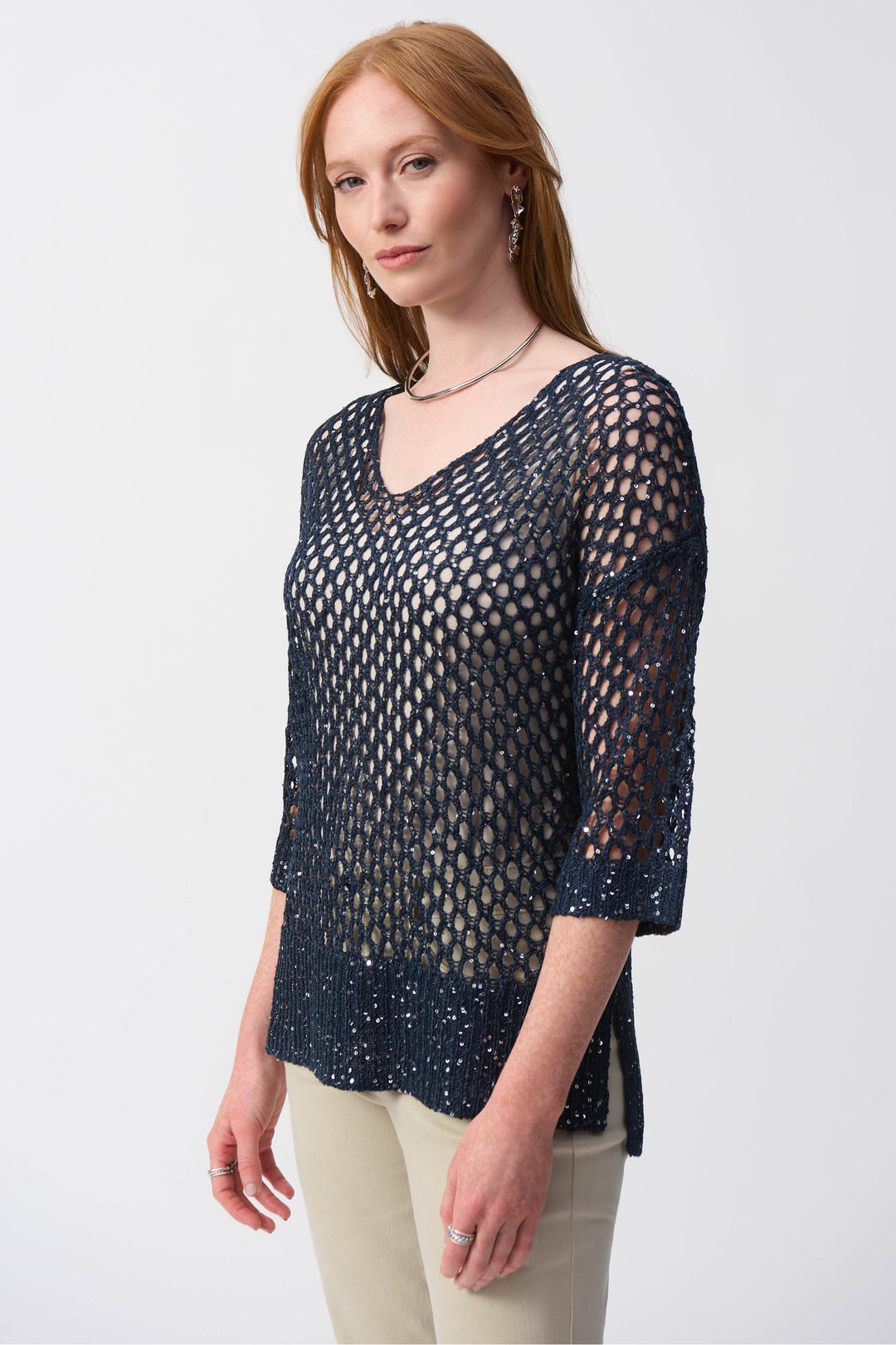 Joseph Ribkoff Spring 2025  The light v-neck and contrasting cuffs and hem add a touch of elegance. Its lace-style design and thick mesh fabric exude sophistication. 