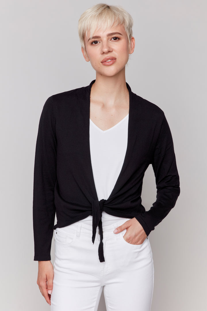 Charlie B Spring 2025 The simple cut makes it a versatile layering piece over any top or blouse. The front tie knot is the star of the show, adding a touch of style to any ensemble.