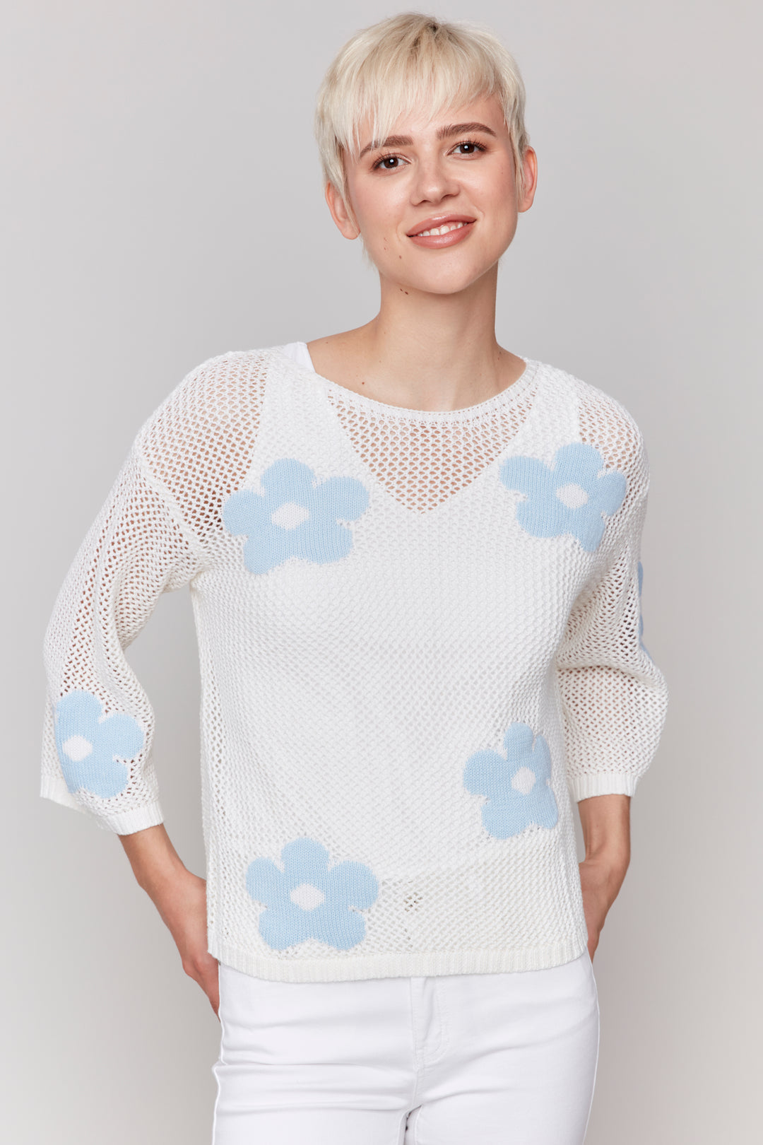 Charlie B Spring 2025 This top is full of daisies🌼 with its charming crochet fishnet design. It's so light, making it perfect for layering over a tank top.