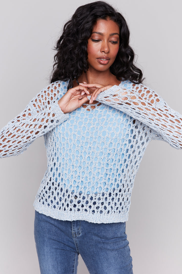 Charlie B Spring 2025 Crafted with an open stitch and crochet braided fishnet design, this top is perfect for layering over a tank top for a chic spring and summer look.