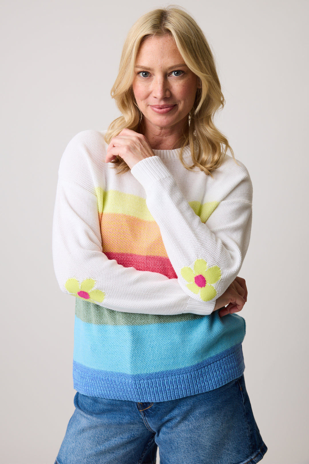 Cotton Country Spring 2025 This colorful top features thick stripes, a crew neck, and a ribbed hem for a cozy fit. The knit fabric is perfect for cooler spring days.