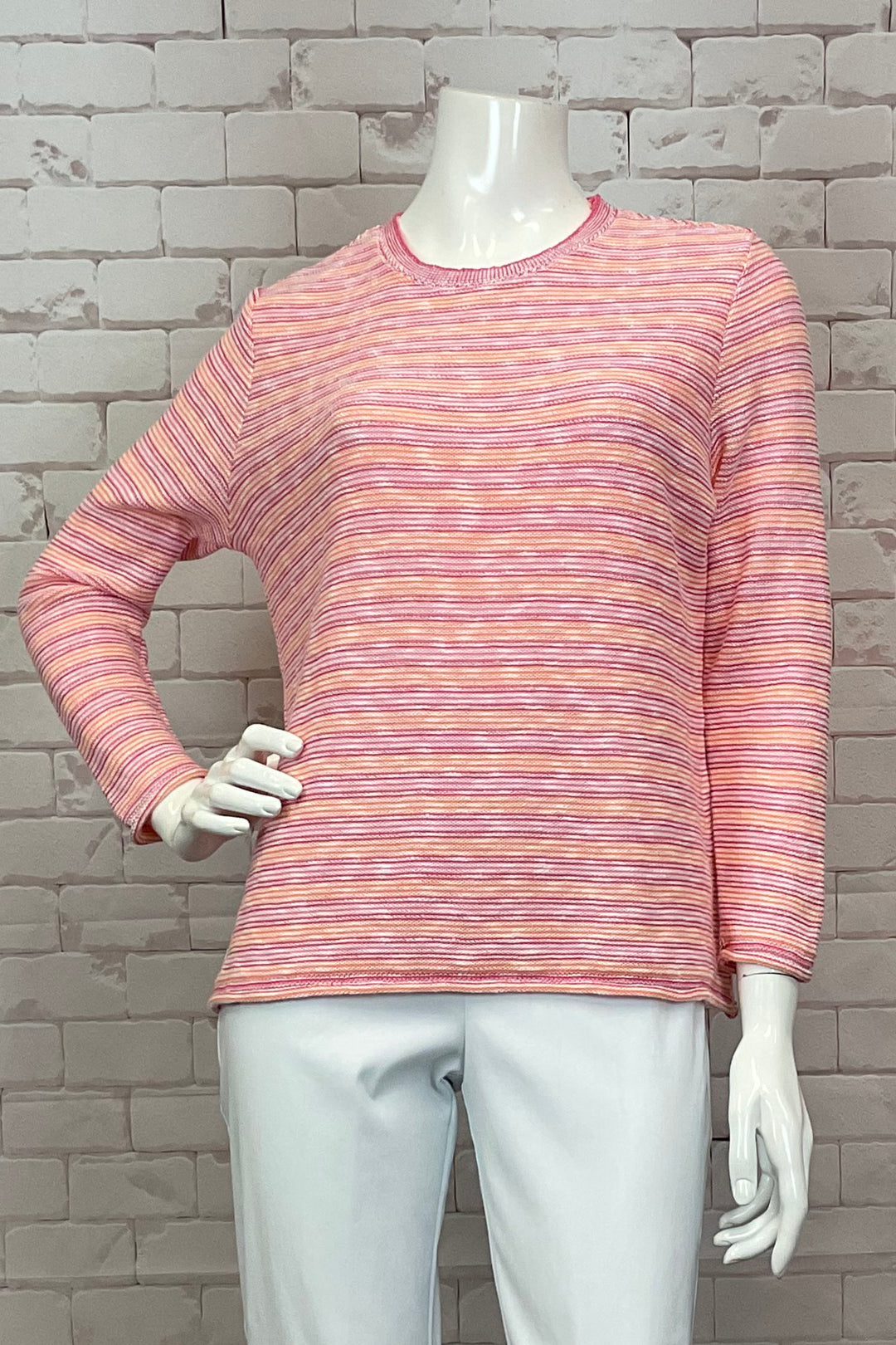 Cotton Country Spring 2025 This light sweater features a crew neckline and full length sleeves for a comfortable fit. The playful rosey stripes design adds a touch of fun and the all-cotton fabric ensures breathability.