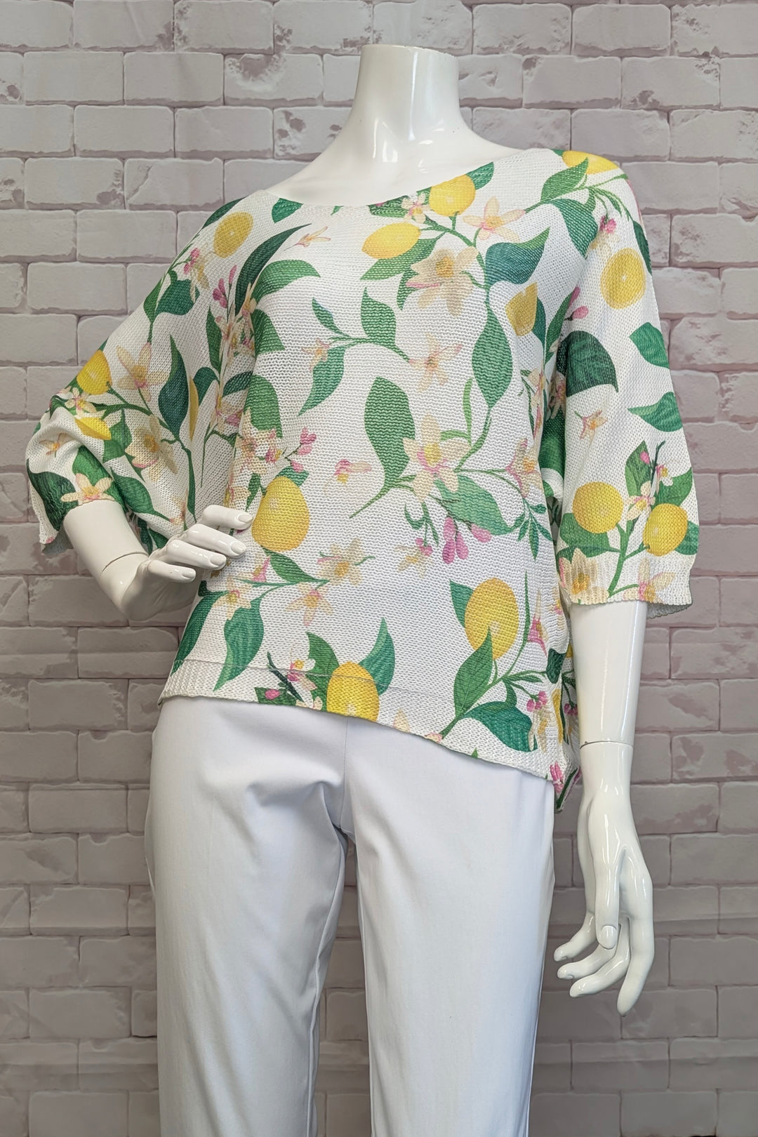 ANGELA MARA Spring 2025  Featuring a slightly loose fit, it ensures comfort while helping you stand out in any crowd. The soft, bright lemon print accented with delicate floral hints brings a fresh, cheerful look! 
