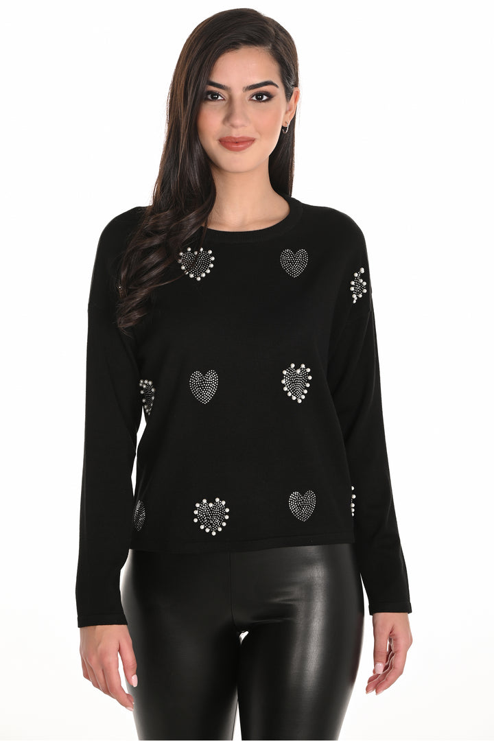 Frank Lyman Fall 2025 This cute top features a bling hearts print that adds a touch of charm and playfulness! The long sleeves and flattering fit make it perfect for any occasion.