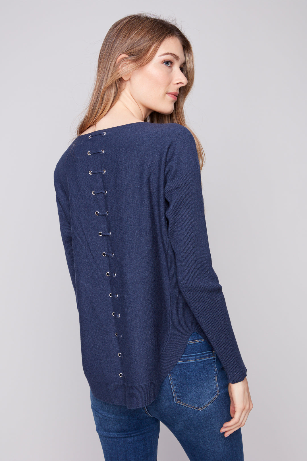 Charlie B Fall 2025 Crafted with a mix of rayon and nylon, the luxe material is as light as a feather yet remarkably strong and durable. Captivating back eyelets and cord details add a unique twist of sophistication to your look.
