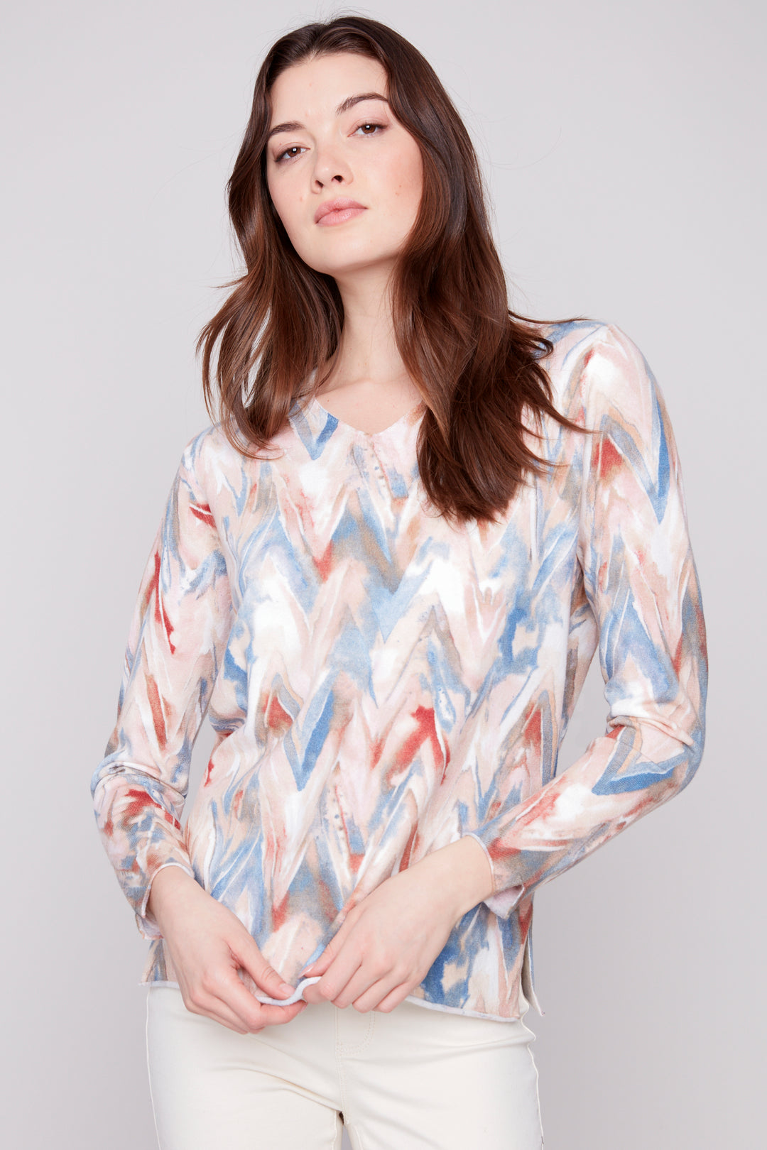 Charlie B Fall 2025 
 With its soft cut v-neck and light sweater material, this top is perfect for transitional weather. 