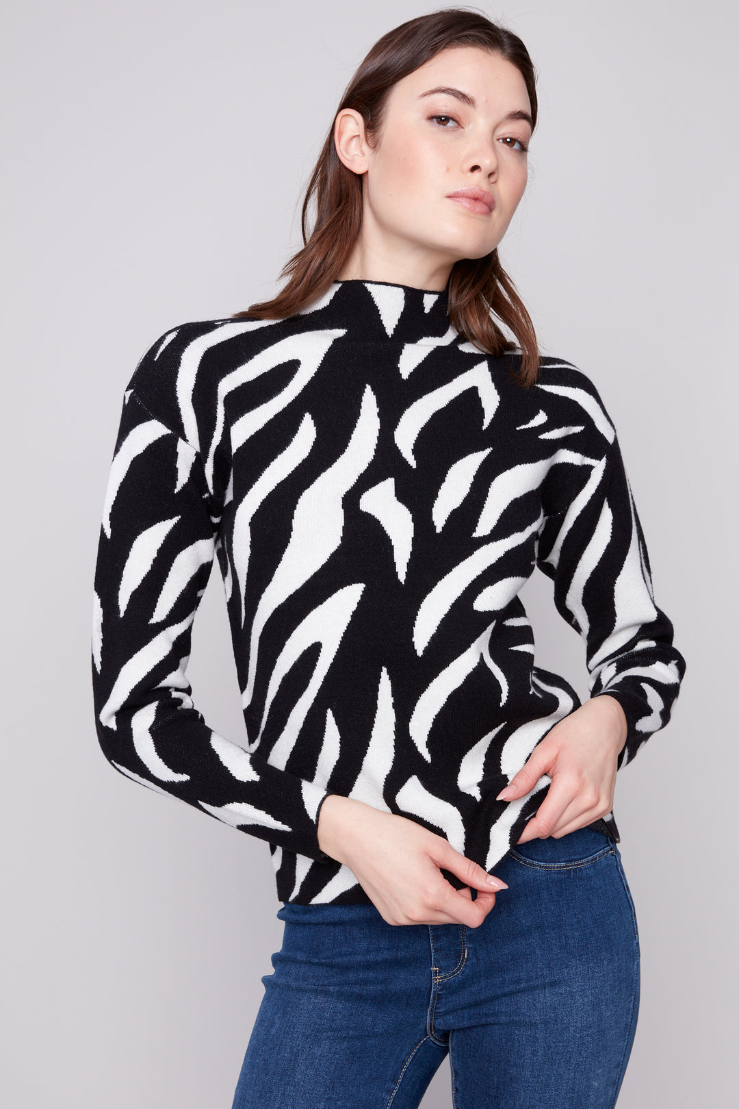 Charlie B Fall 2025 
This zebra printed long-sleeve top features a stylish mock neckline and a lightweight sweater fabric, blending comfort with fashion. 