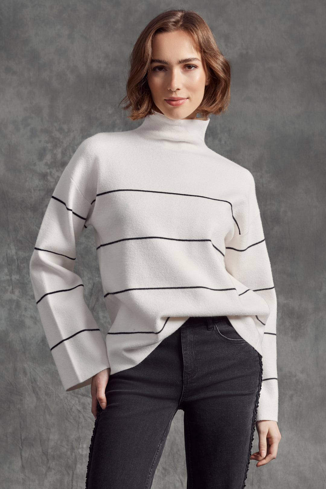 Charlie B Fall 2025 
Featuring a cozy funnel neckline and relaxed drop shoulders, it offers a flattering fit and long sleeves for added warmth.