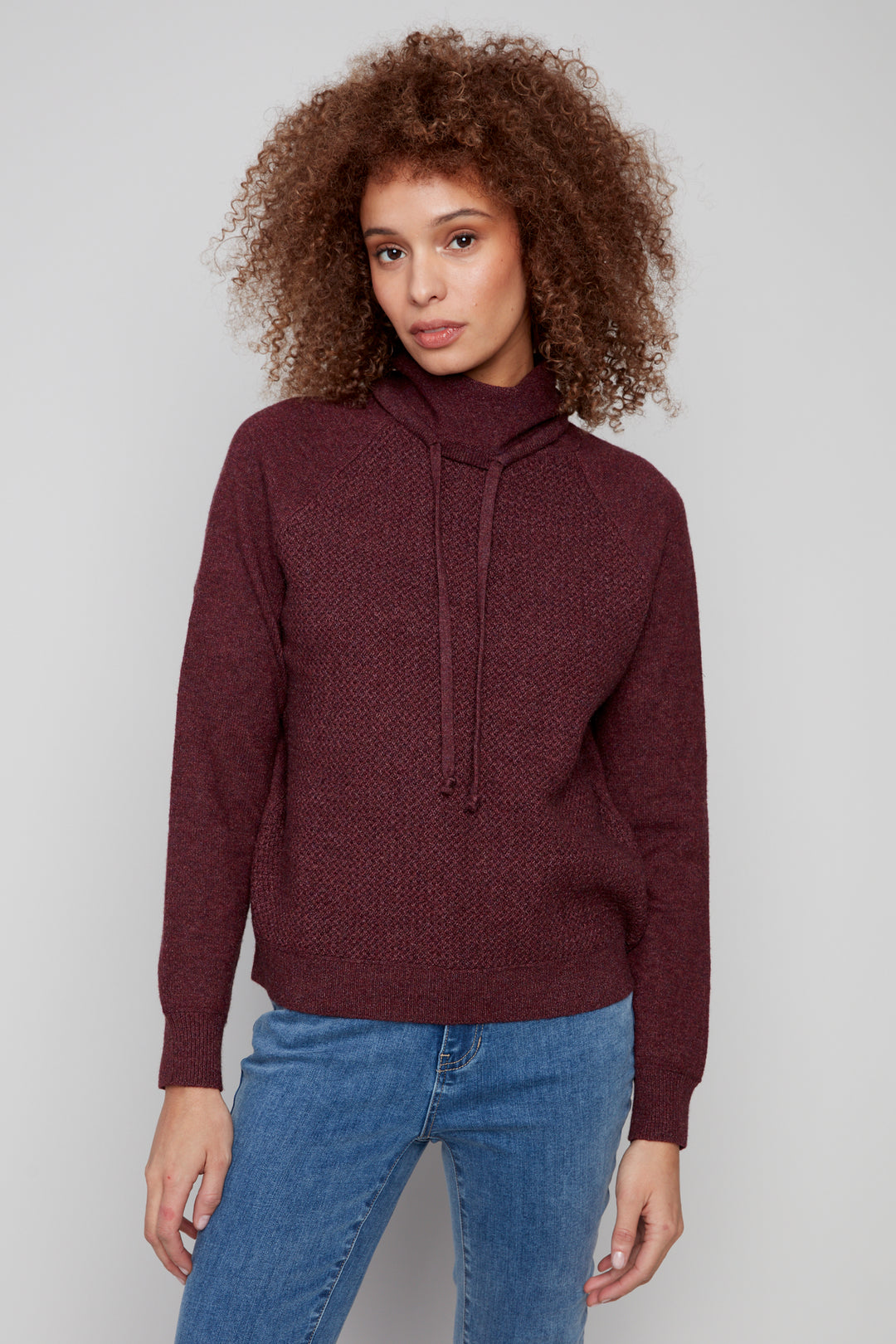Charlie B Fall 2025 
This textured light sweater is designed to keep you warm and cozy without compromising on style. It features a cowl neckline and texture design, adding a contemporary edge.