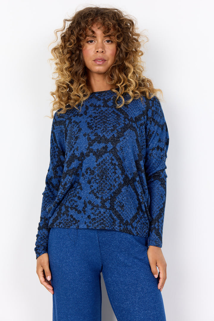 Soya Concept Fall 2025 
 The sleek, round neckline and stylish sweater top make a statement while the light and comfy fabric ensures all-day comfort. The slick snake print pattern adds a touch of wild to any outfit! 