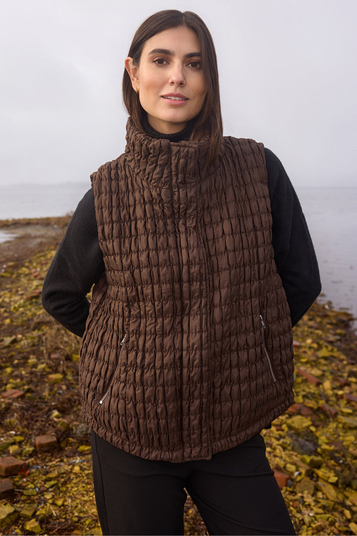 Soya Concept Fall 2025 
This quilted vest is designed with large front zipper pockets and a high collar for optimal functionality and warmth.