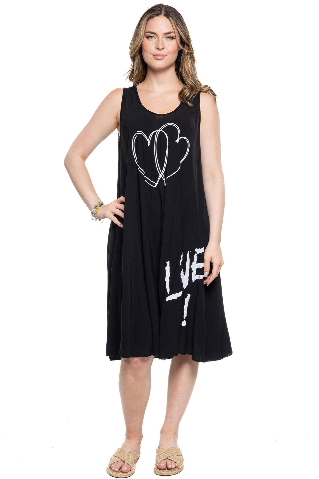 Etern Elle Summer 2024  This sleeveless dress will keep you nice and chill, while the cute heart print adds a touch of charm. The deep cut round neck and knee length make it perfect for any casual occasion. 