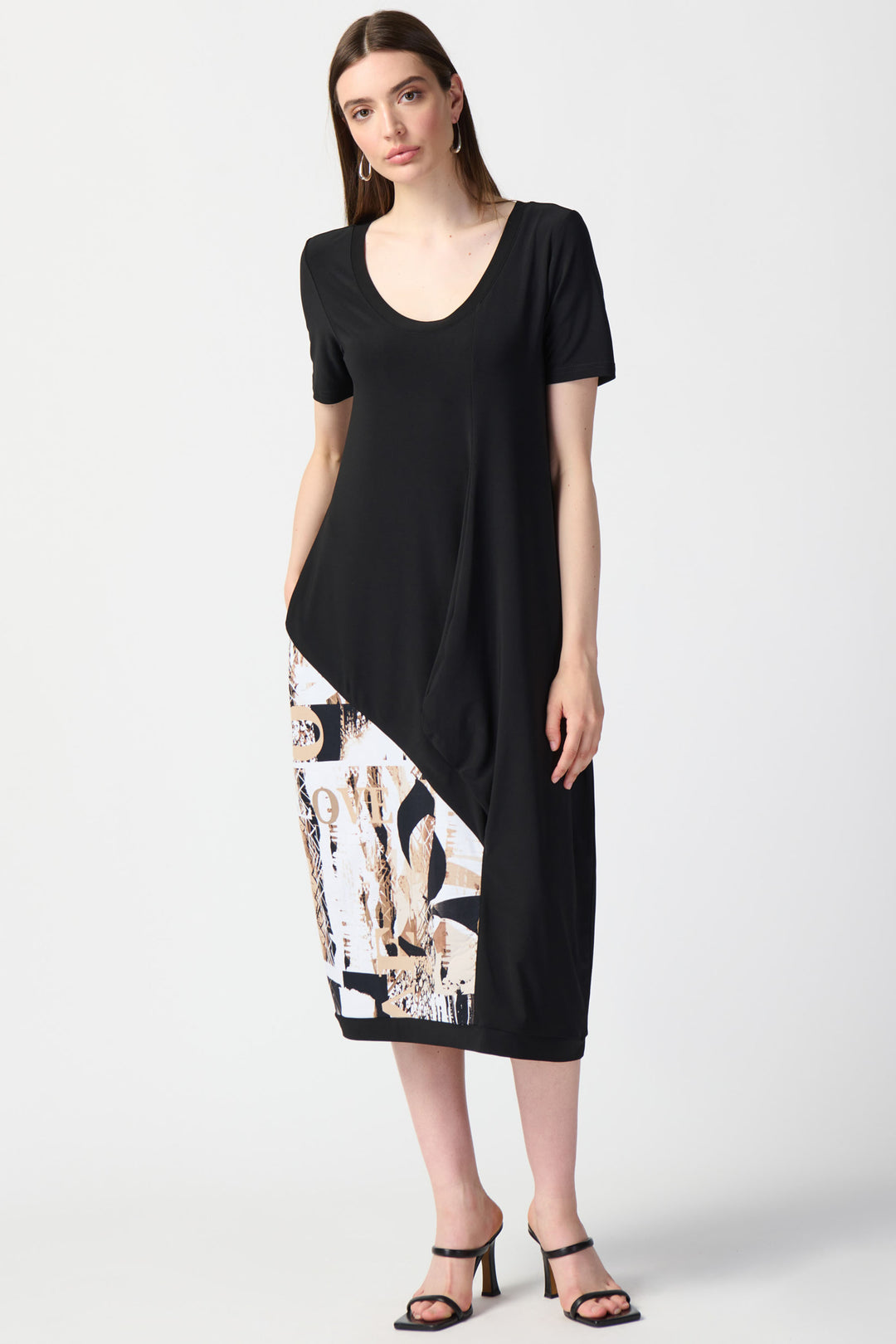 This bold yet simple Cocoon Dress features a relaxed fit, midi-length and round neck design. 