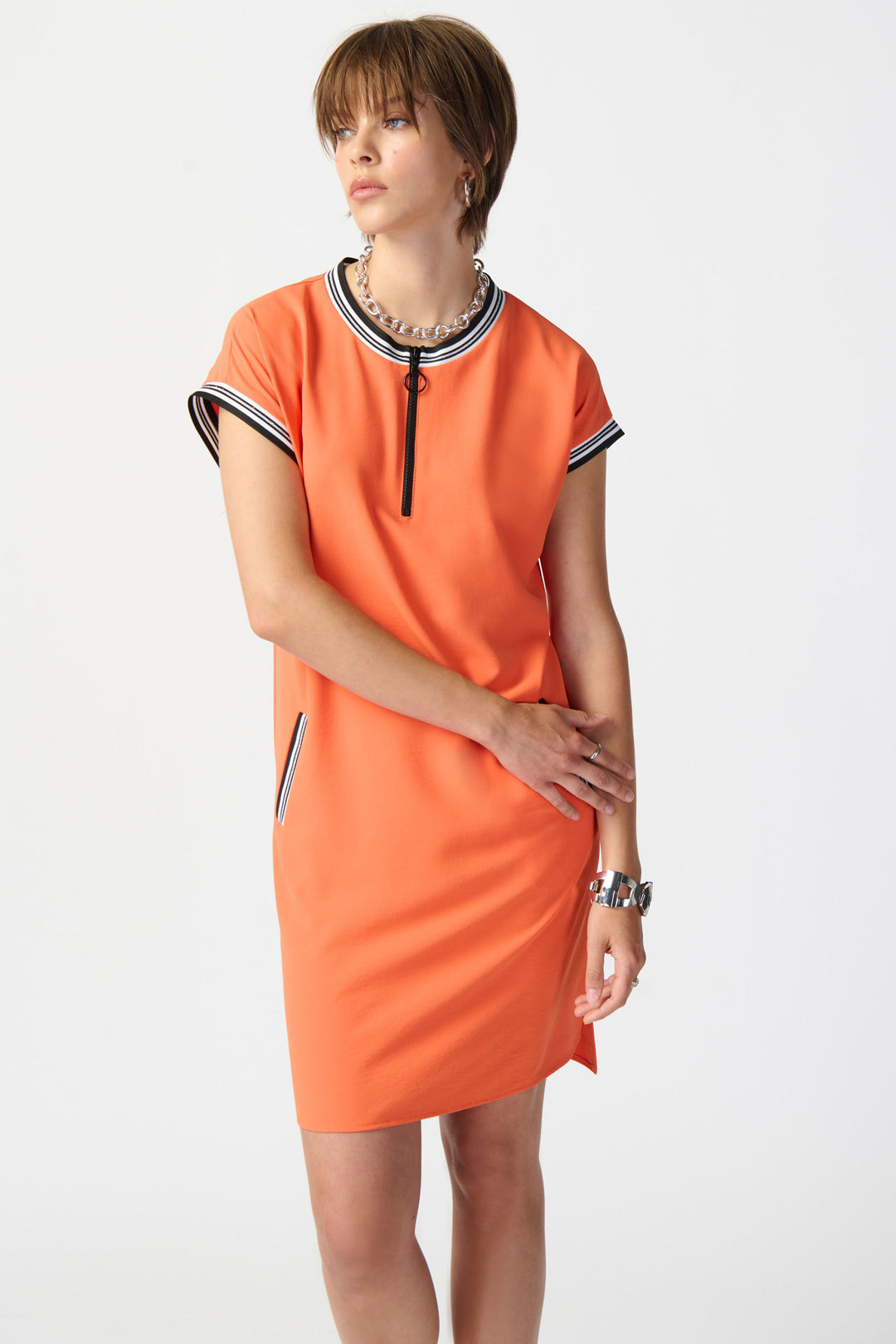 JOSEPH RIBKOFF Spring 2024 The light and relaxed fabric, combined with the quarter front zipper and contrast striped   detailing at the neckline and cuffs, adds a touch of sophistication.