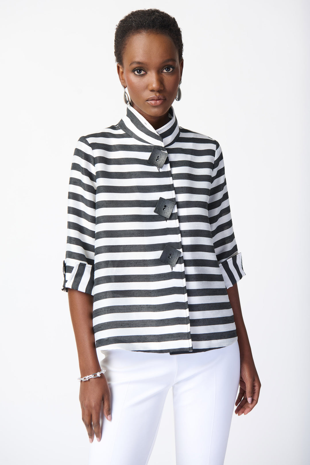 Joseph Ribkoff Summer 2024 The stand up collar and 3/4 length cuffed sleeves add a touch of sophistication, while the stunning 'zebra' print and 3 button design elevate this jacket to a whole new level.