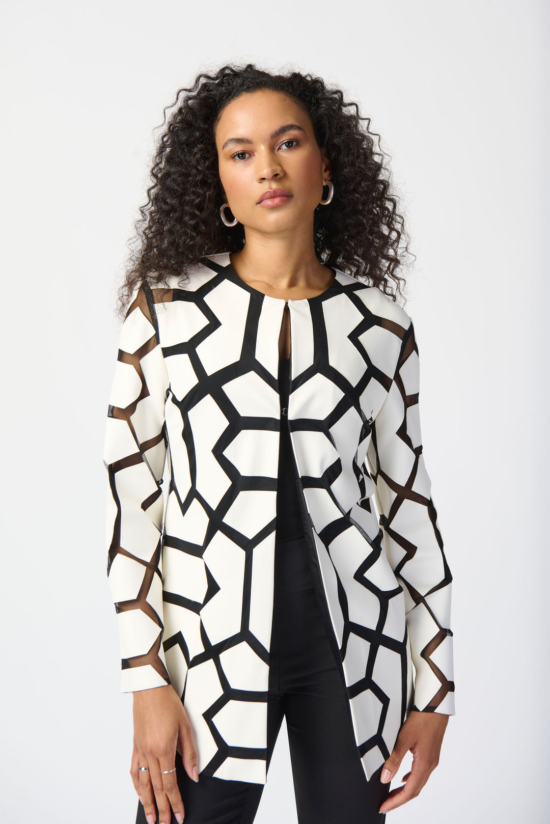 Joseph Ribkoff Summer 2024 Featuring a striking geometric pattern design and a straight cut that accentuates your hips