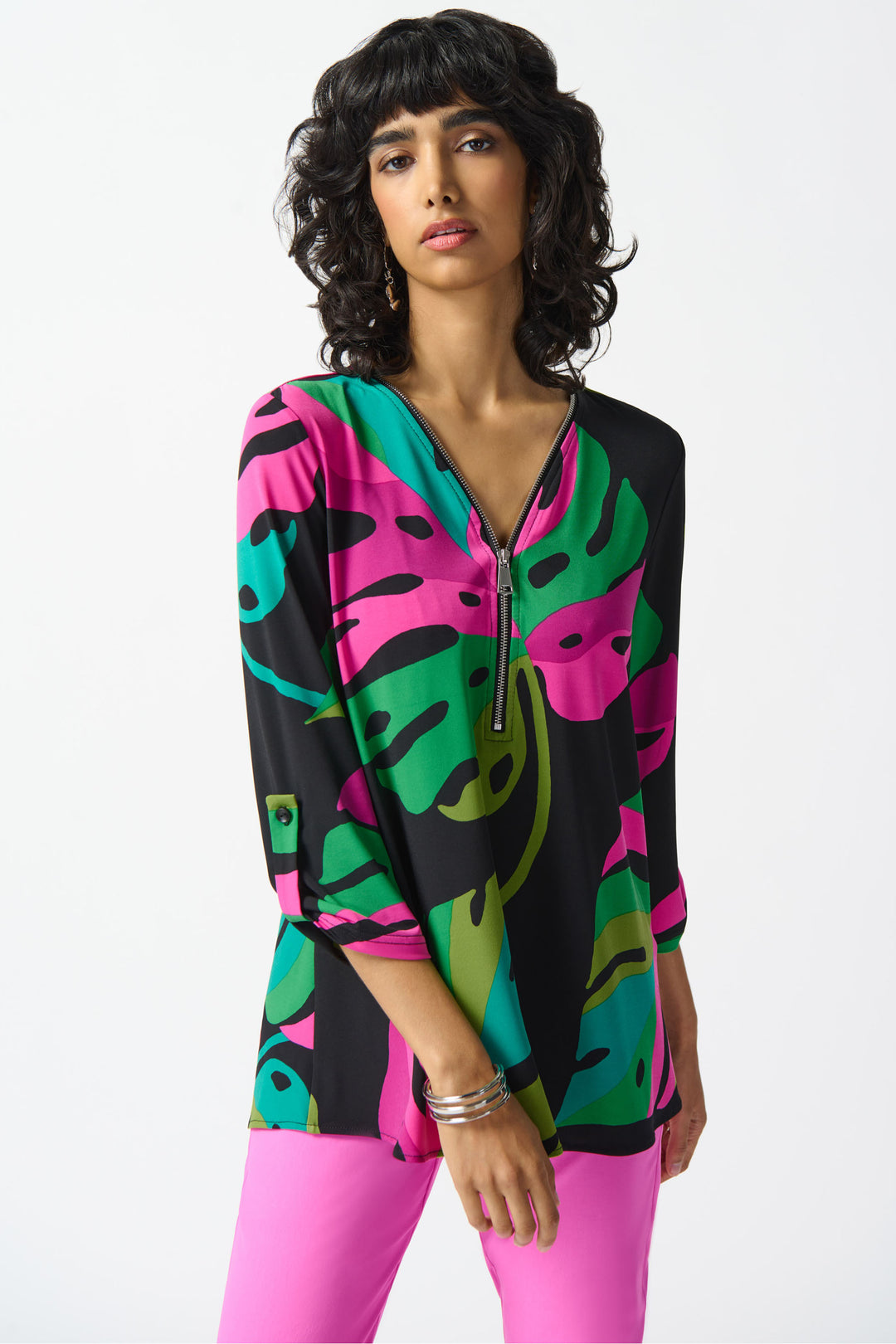 This ultra-soft and lightweight top features a vibrant floral print and a playful v-neck with zipper.