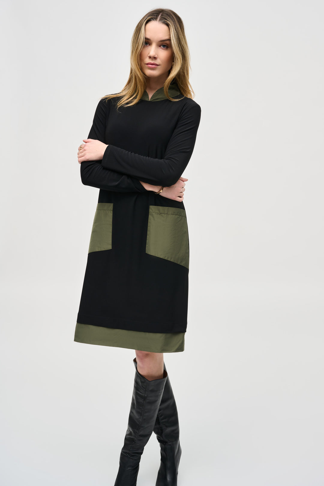 Joseph Ribkoff Fall 2024  The high-neck style and full length straight sleeves add a touch of elegance, while the large memory pockets on the side offers convenience and functionality. 