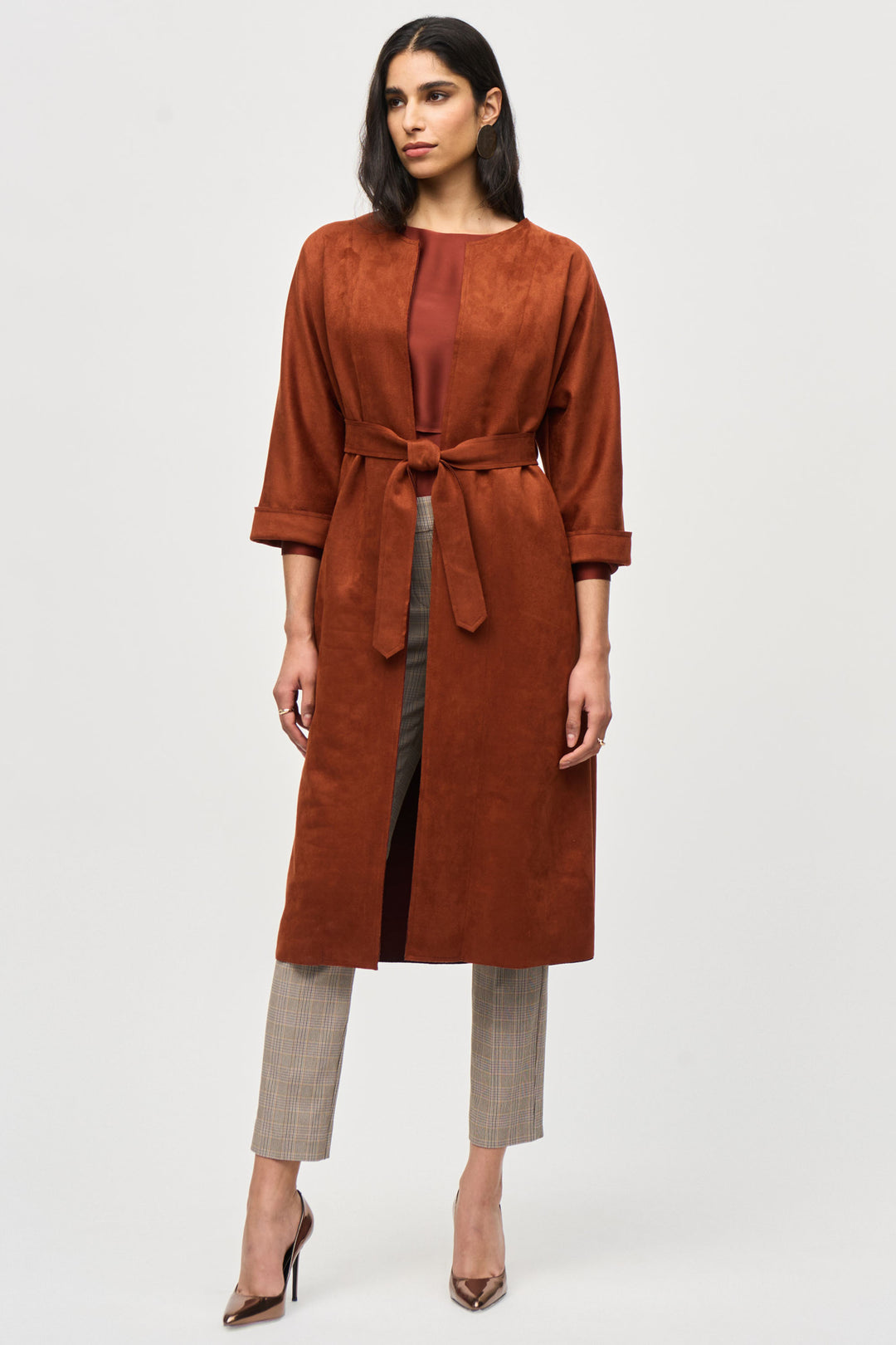 Joseph Ribkoff Fall 2024  The solid colour, plain pattern, collarless design and open front style give this ultra-modern piece a timeless elegance, while the practical side pockets add functionality. 