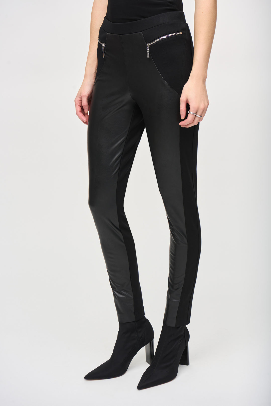 Joseph Ribkoff Fall 2024 The Pleather Front Pant offers an easy pull-on style, featuring a straight cut, elastic waist and zip side details. Crafted with a luxury faux leather fabric for a comfortable fit.