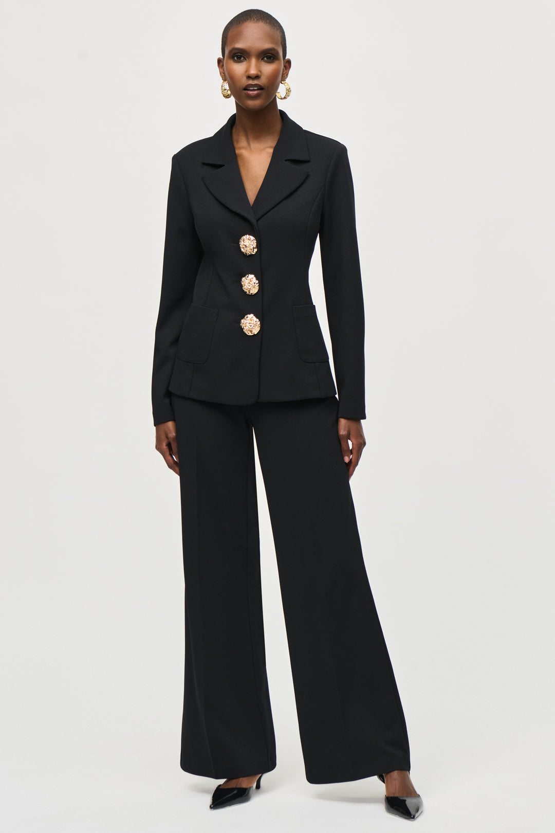 Joseph Ribkoff Fall 2024 Flow with ease in these wide-leg pants, adorned with elegant button details at the hips. A high-rise waist and soft fabric make for comfortable, easy wear.