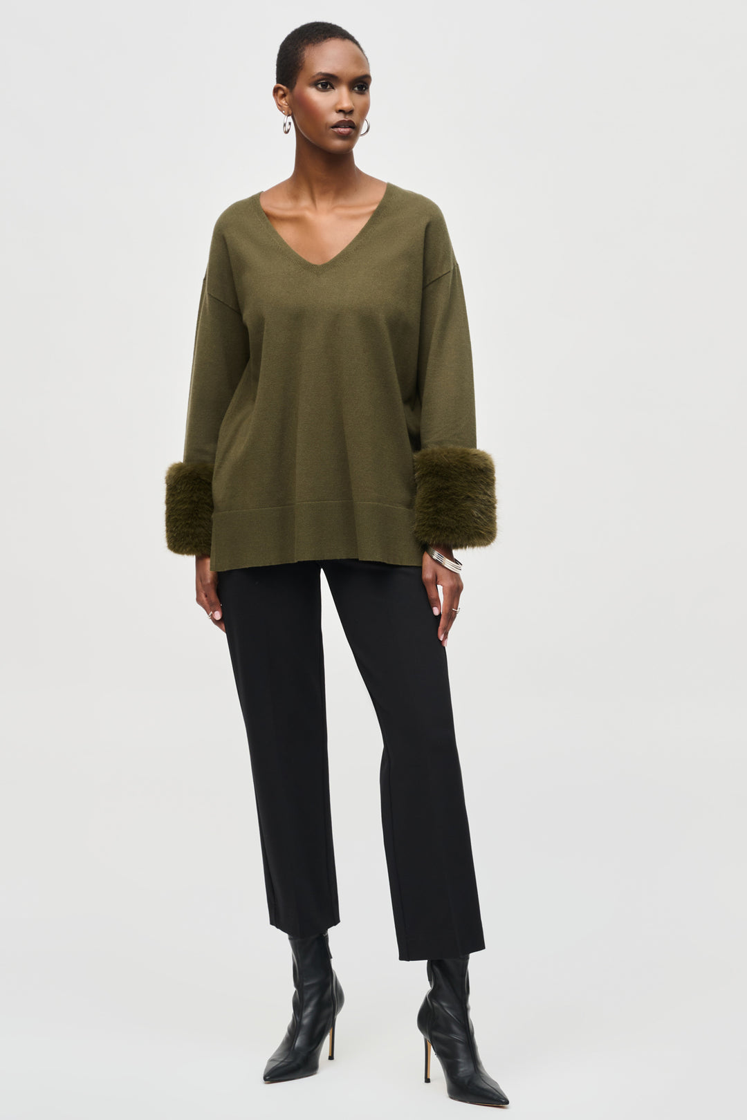 Joseph Ribkoff Fall 2024 Expertly crafted for comfort and style, the Heavy Knit Straight Pant boasts a wider fit and high-rise design. With ankle length and an elastic waist, it's perfect for the office or any moderately formal event. 