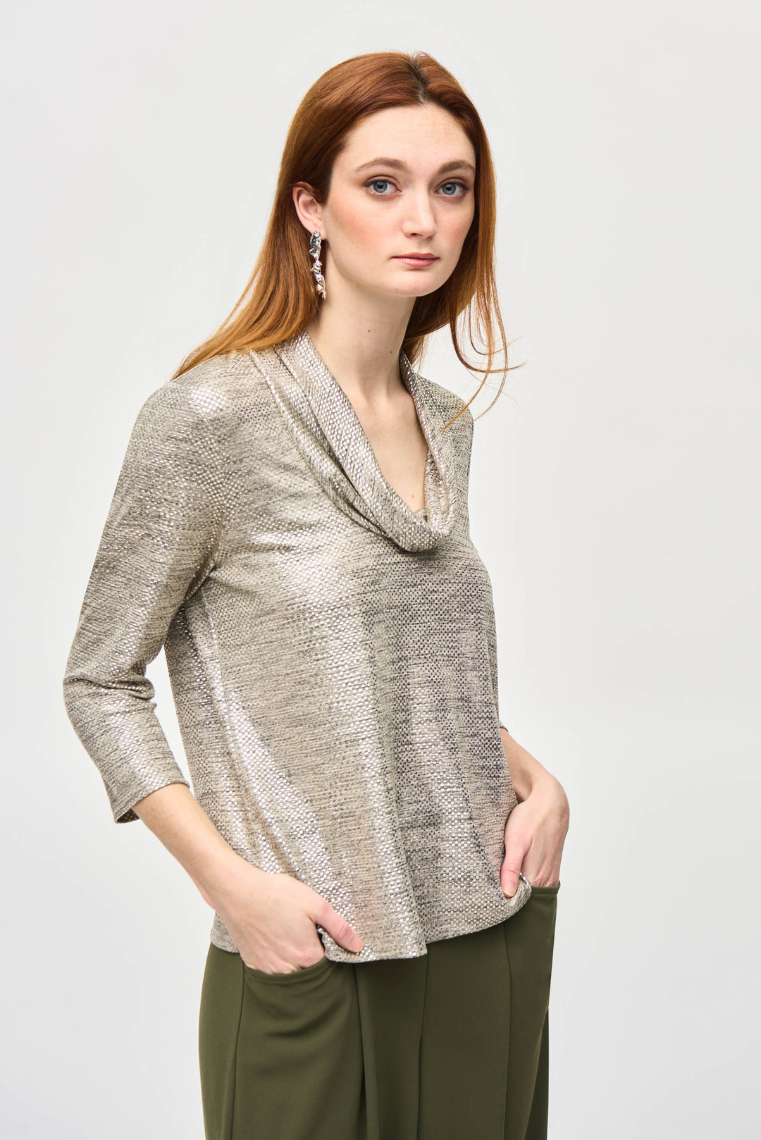 Joseph Ribkoff Fall 2024 The gorgeous drape of the cowl neck adds a touch of elegance to this top, made from a blend of polyester and spandex for a flattering straight fit.