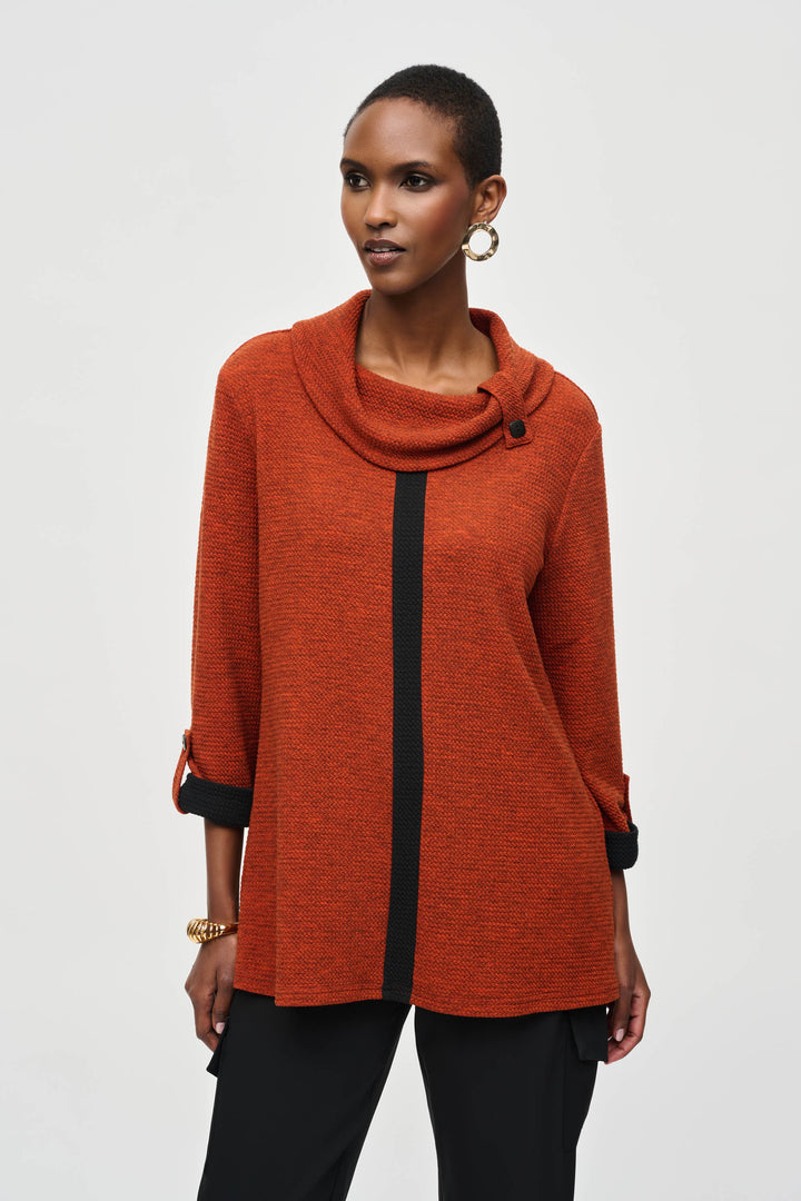 Joseph Ribkoff Fall 2024 Styled with button tab 3/4 sleeves, it features a snuggly cowl neck for an ultra-cozy feel. Ideal for everyday fall wear, this tunic adds the perfect amount of comfort and style.