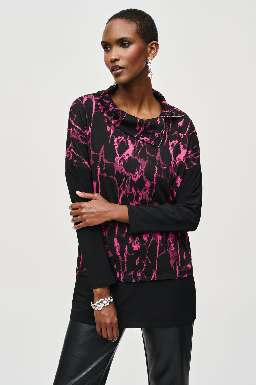 Joseph Ribkoff Fall 2024  The cowl neck and full length sleeves create an elegant silhouette, while the diagonally placed zipper at the neck lends a unique edge to this piece. 