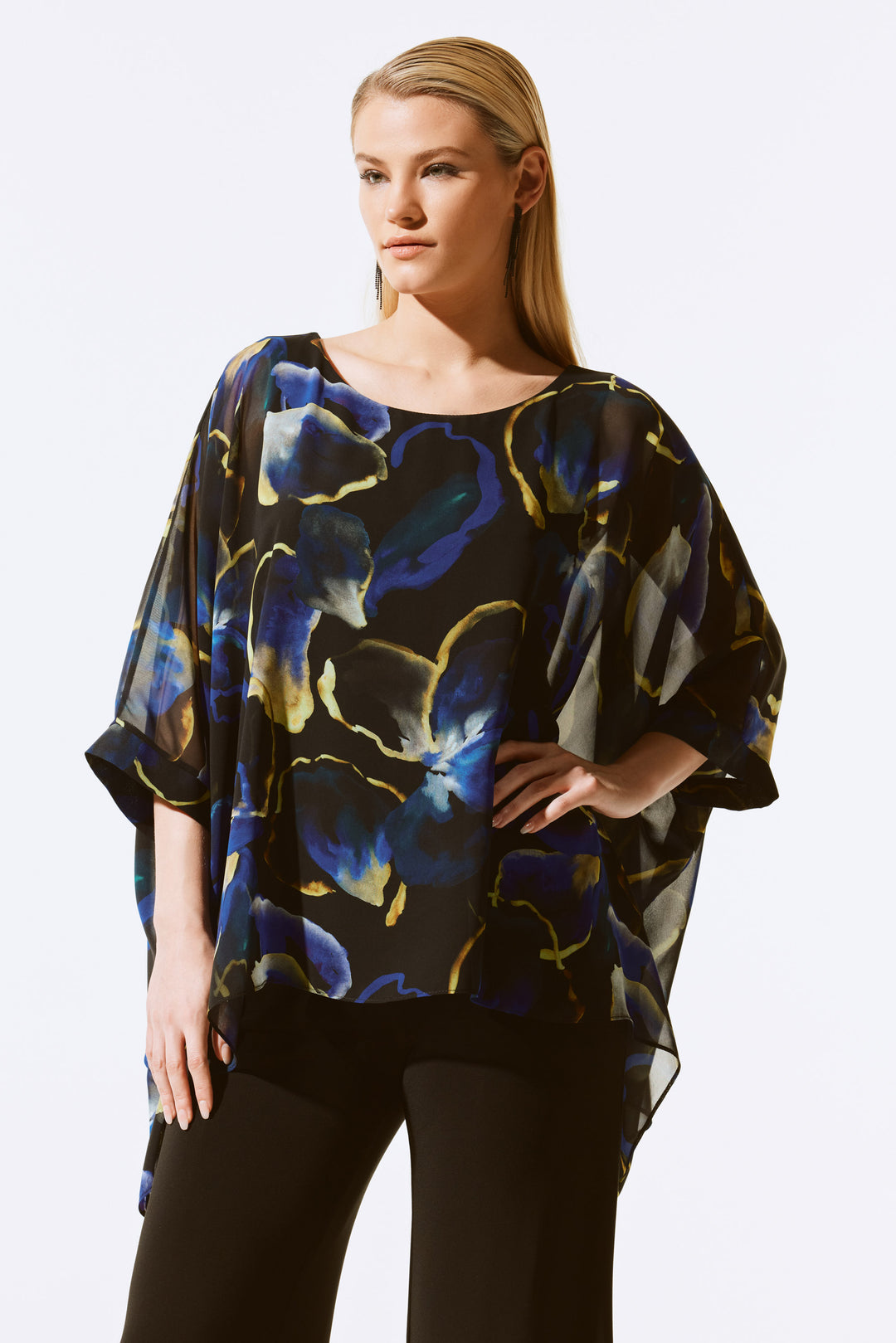 Joseph Ribkoff Fall 2024 Elevate your look with this stunning Floral Chiffon Poncho Top! The poncho style and loose fit keep you comfortable and stylish. Look gorgeous and feel even better for any special fall soirée!