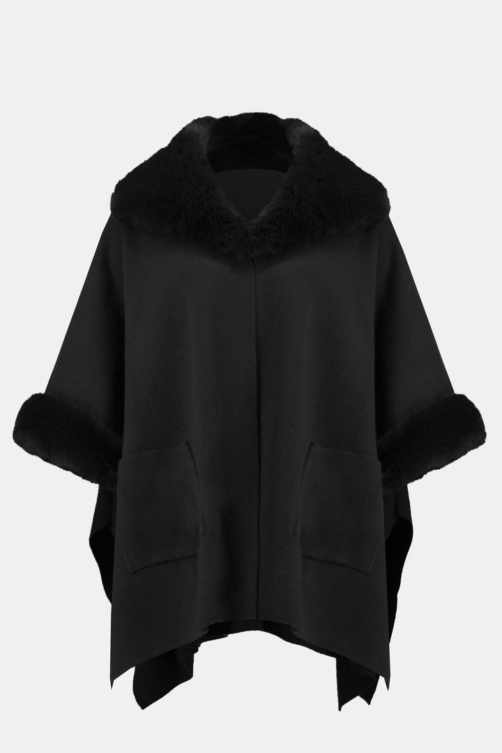 Joseph Ribkoff Fall 2024 Show off the distinct faux fur cape style poncho, with faux fur contouring the neckline and make a statement this fall season!