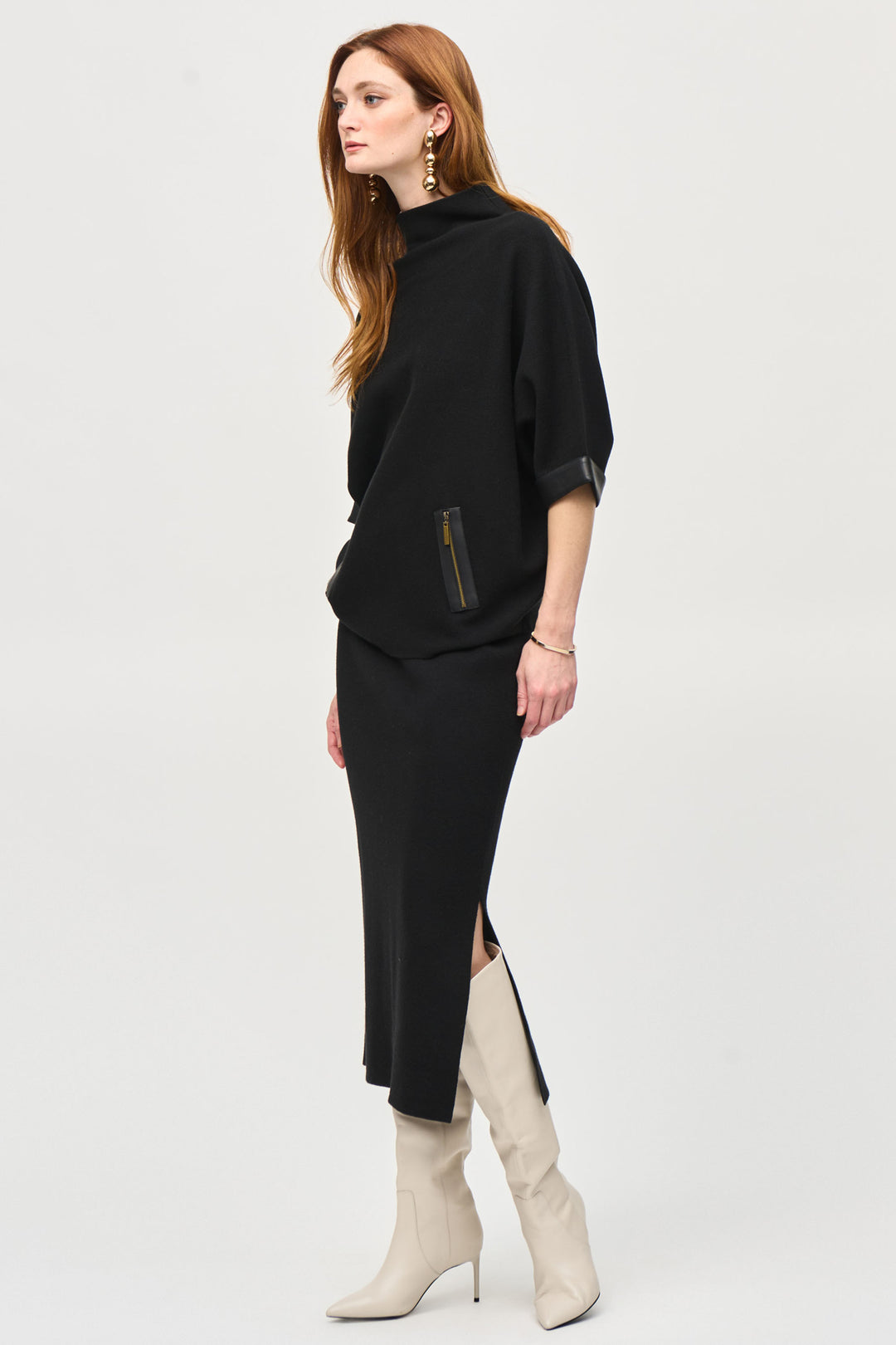 Joseph Ribkoff Fall 2024  The knit fabric offers a comfortable fit, while the elastic waistband ensures a perfect fit. The side slit adds a touch of flair to this classic skirt. 