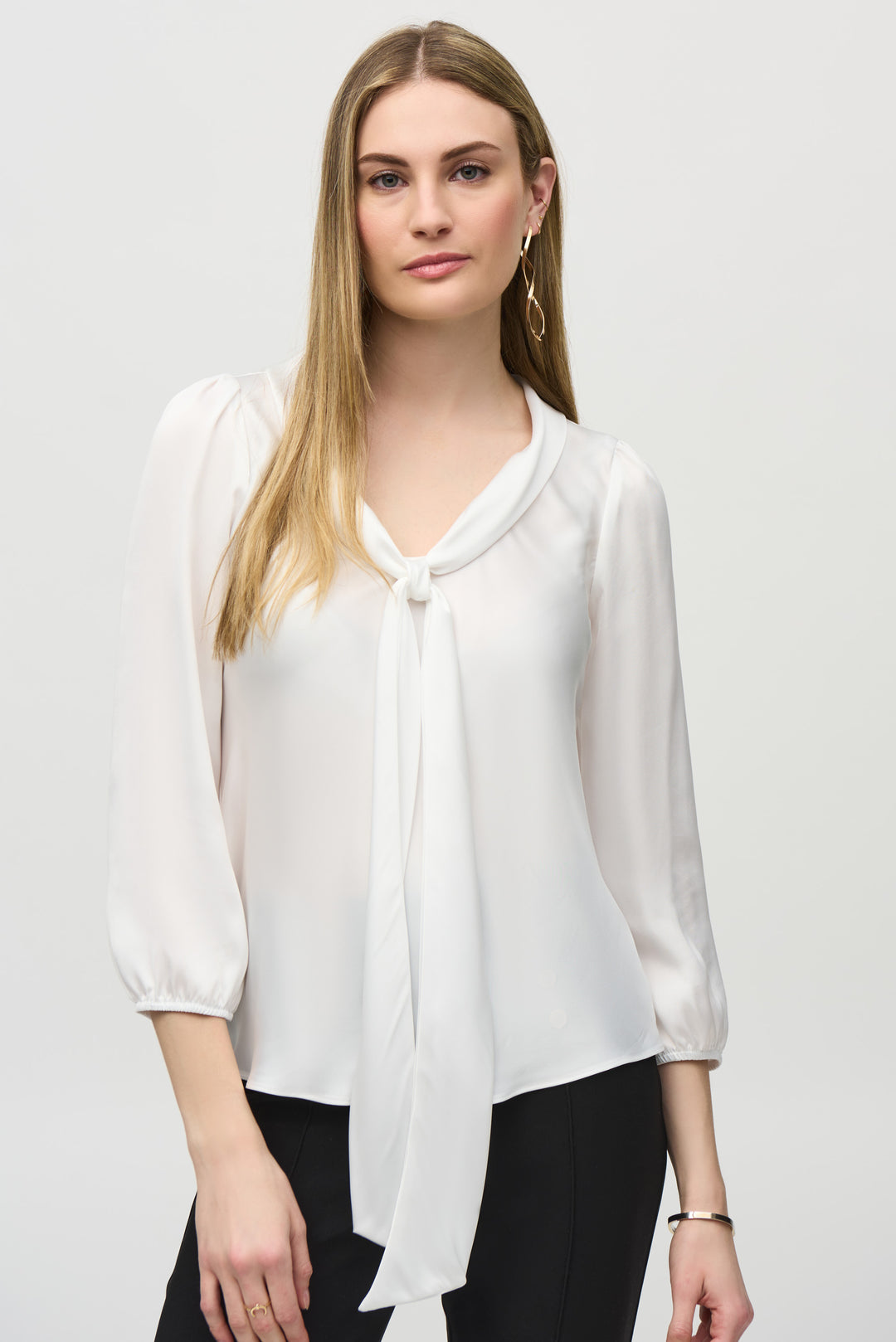 Joseph Ribkoff Fall 2024 This Long Sleeve Satin Top With Tie Neck boasts a lovely tie neck detail, adding a touch of elegance to your wardrobe. 