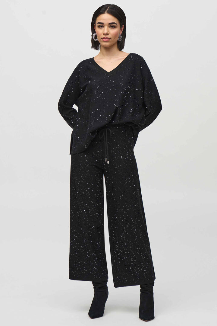 Joseph Ribkoff Fall 2024 Effortlessly stylish with its sparkly design and wide-leg pants, these culottes offer comfort and convenience with its elastic waistband. 