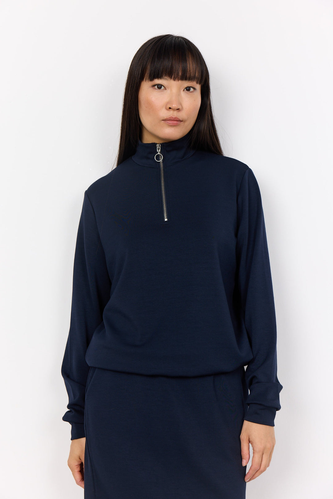 Soya Concept Fall 2024 Expertly crafted for ultimate versatility, our Long Sleeve Zip Mock Top is the perfect addition to any wardrobe. 