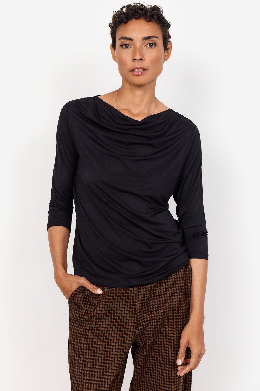 Soya Concept Fall 2024 Made with super soft fabric and featuring a drape boatneck design, you'll stay comfortable and stylish. With 3/4 length sleeves and a standard fit, this tee is a must-try!