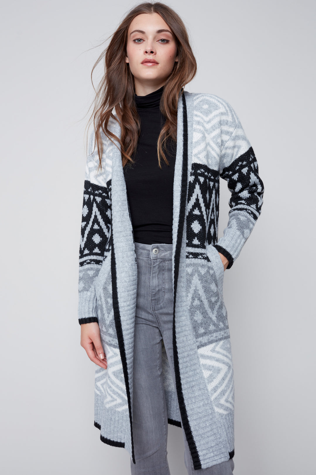 Its stunning aztec pattern says fall and winter, while its pockets make it as functional as it is fashionable.