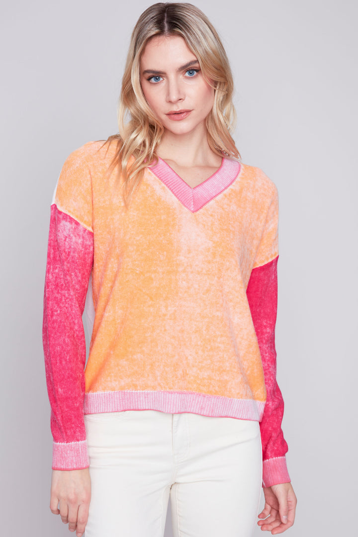  Perfect for the spring and summer, this all-cotton light sweater features blocks of fun colour and a smart v-neck style with long sleeves. 