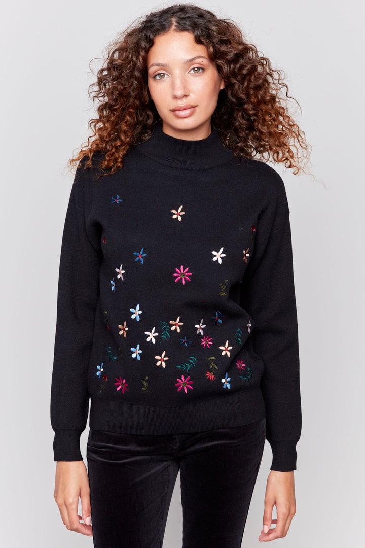 Charlie B Fall 2024 This beautiful sweater offers a cozy mock neck, round hemline and intricate embroidered flower details that make it perfect for any day!