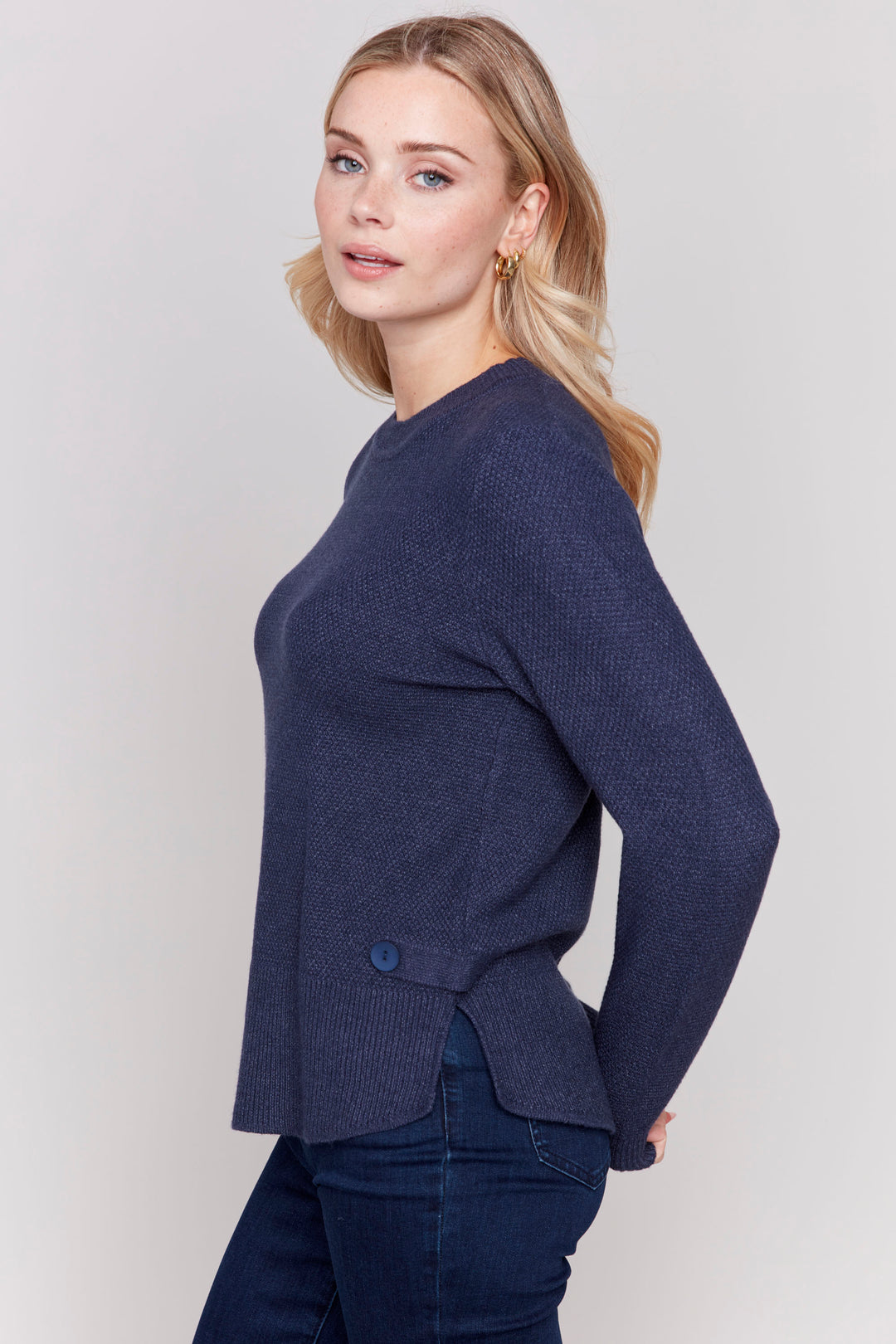 Charlie B Fall 2024 Elevate your style with our Long Sleeve Top featuring a sophisticated knit design and elegant side tab and button details. 