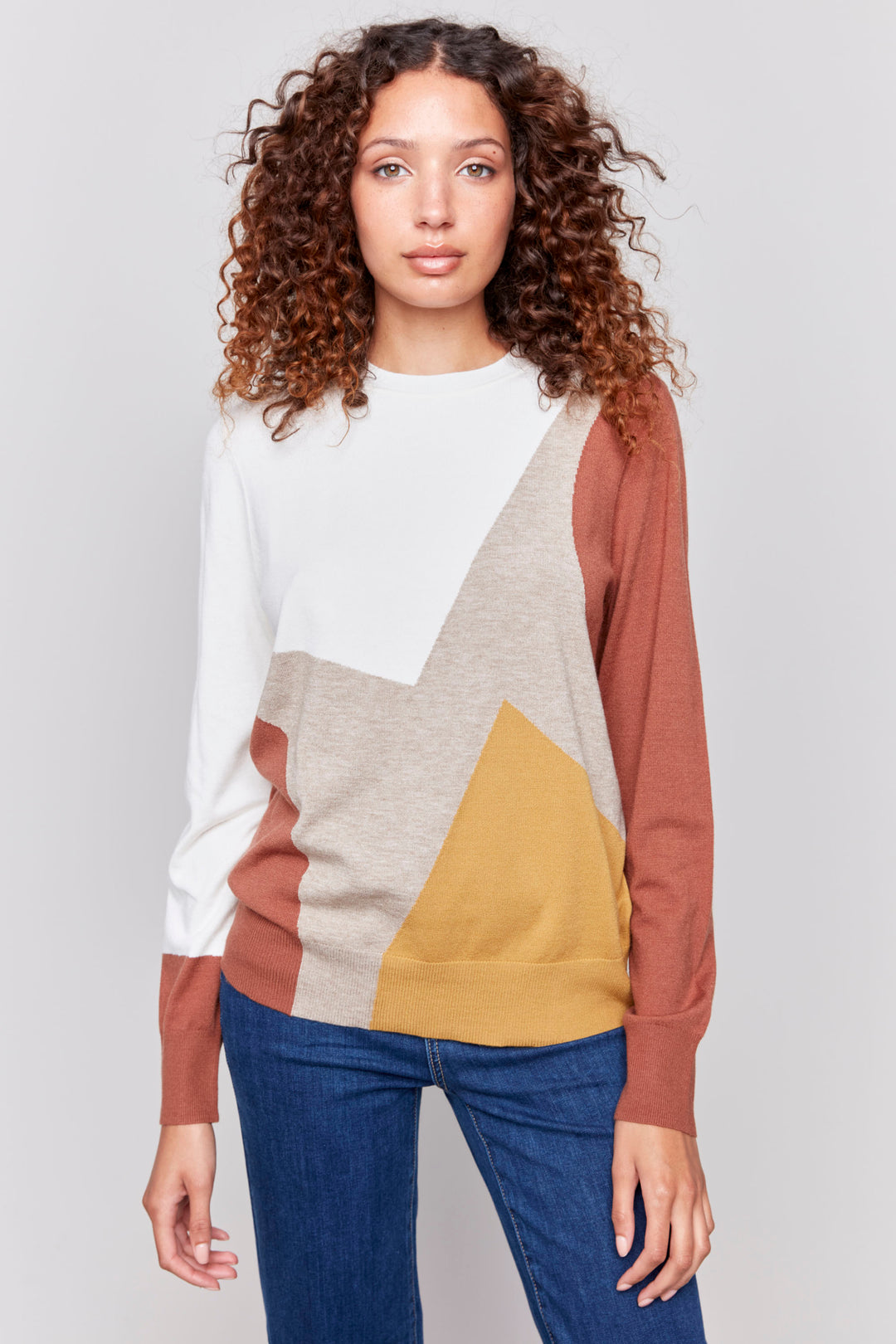 Charlie B Fall 2024 The new Long Sleeve Colourblock Top is a fashionable piece made from a blend of rayon and nylon. 