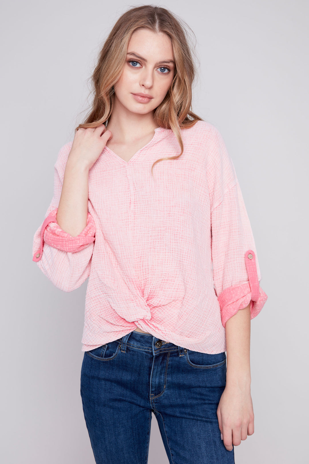 Made of all cotton, this sleek top features a neat tie knot at the hem and rolled sleeves for a washed out, laid-back look. 