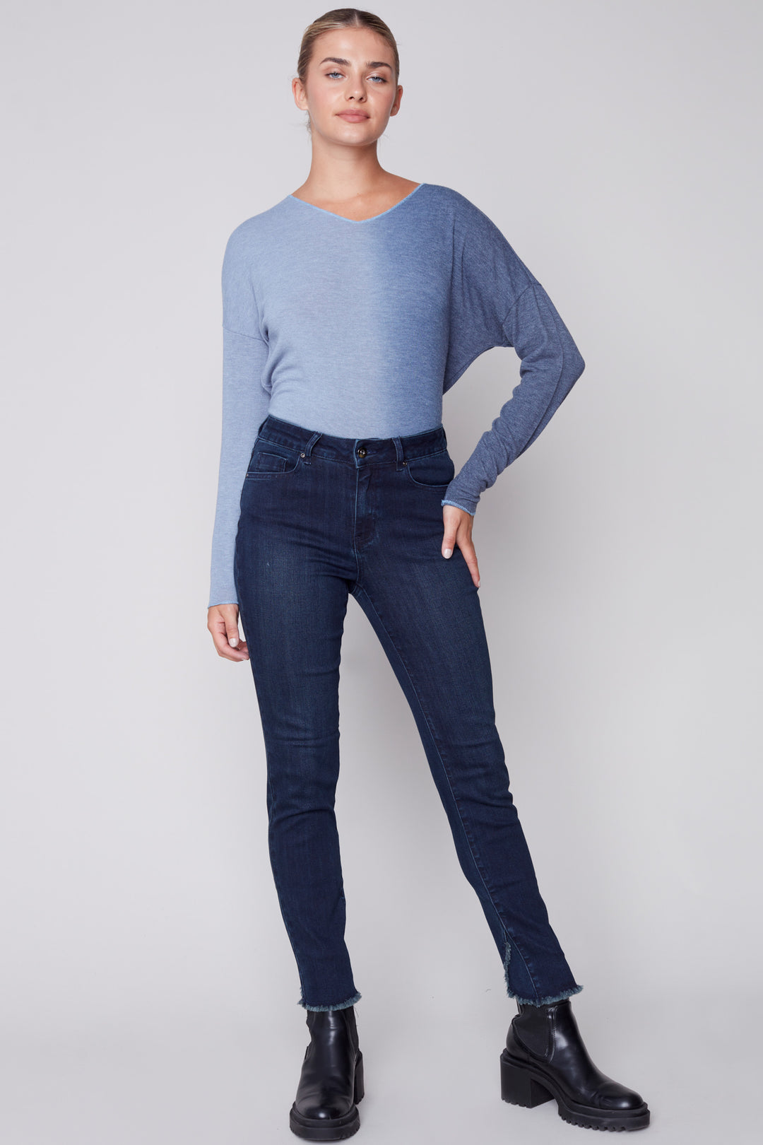 Crafted with a super stretchy denim and a unique tulip hem featuring a frayed, raw edge, these well-fitted ocean deep blue jeans will make a statement with every step!