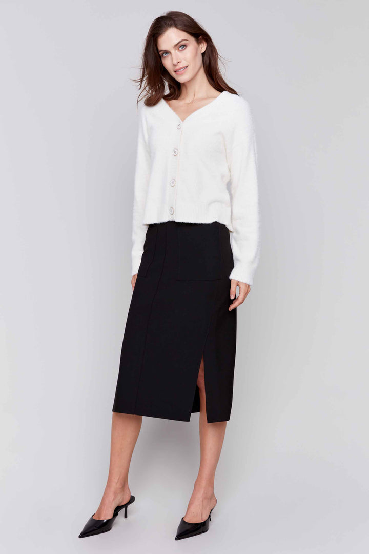 Charlie B Fall 2024 With a knee length and side cut slits, this skirt is versatile enough to take you from the office to a night out! Pair it with a light sweater or a blouse for a stylish look this season.