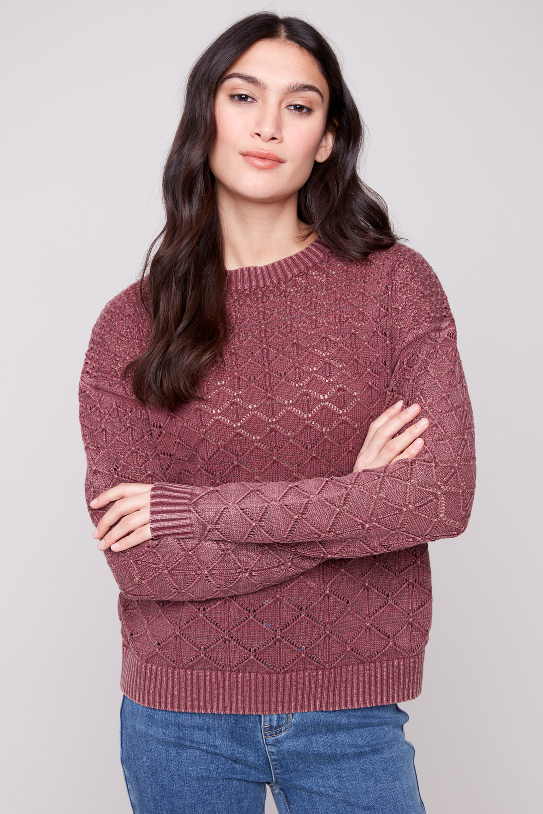 Charlie B Fall 2025 
The unique cold dye colouring adds a touch of sophistication to the classic knit pointelle design pattern. The round neck and contrast neckline, hem and cuffs make this top a must-have for those seeking an exclusive and tasteful look.